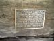 Brass commemorative plate on William and Sarah Hendrix old cabin.
